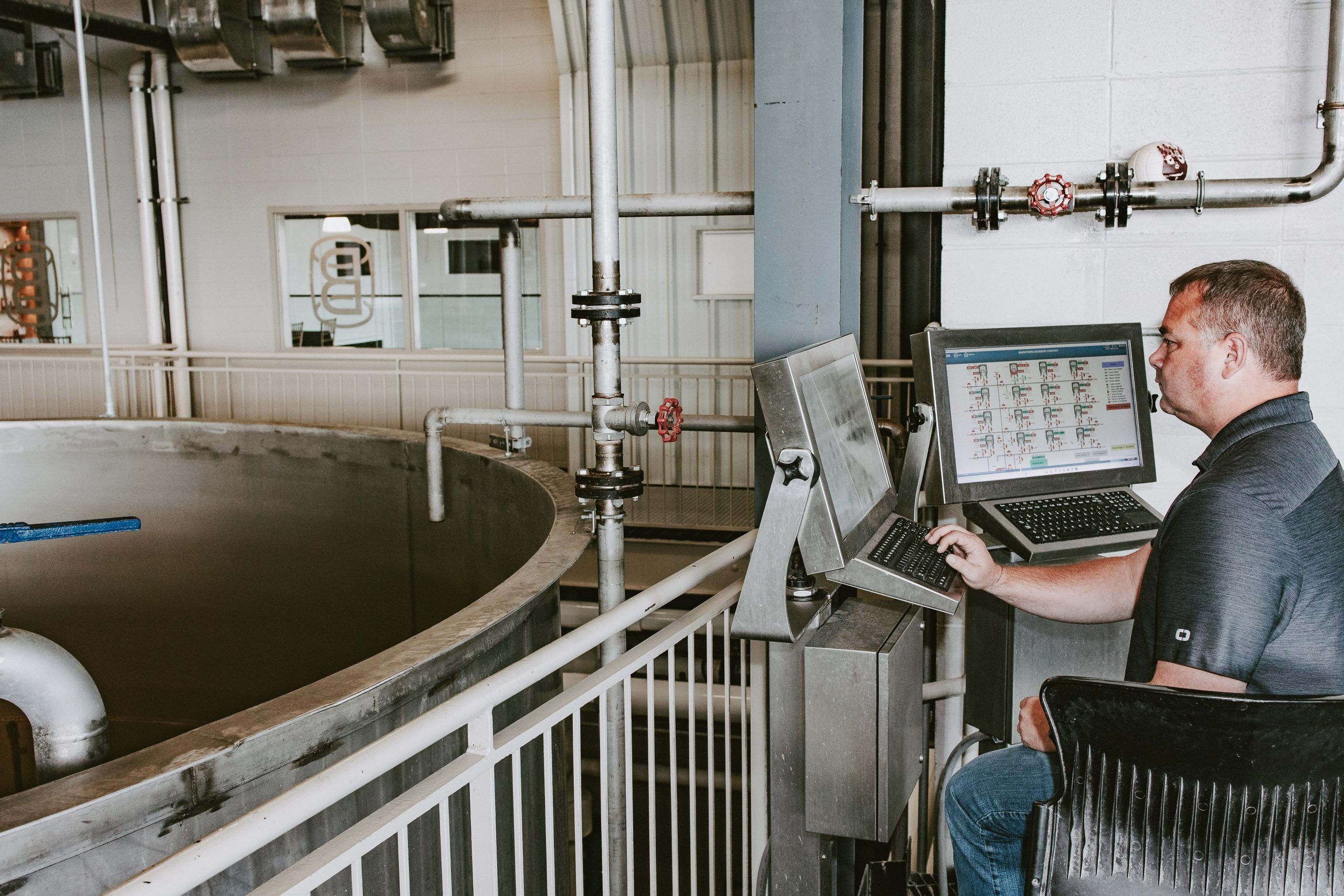 Aaron Butler, Senior Project Manager at Lofted Spirits, using the software at Bardstown Bourbon Company